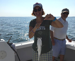 Woman Holding a Fish